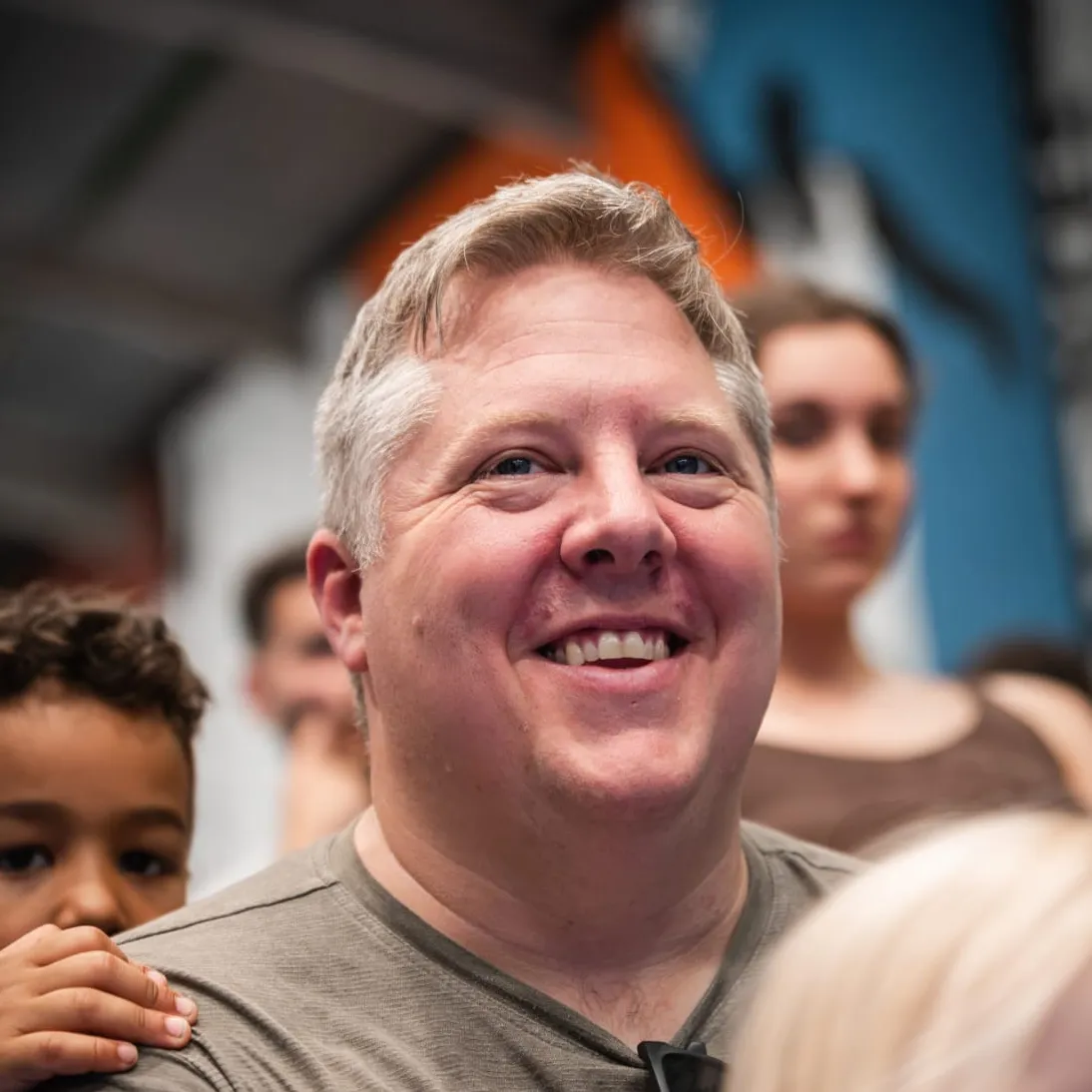 Brian, grinning in a crowd