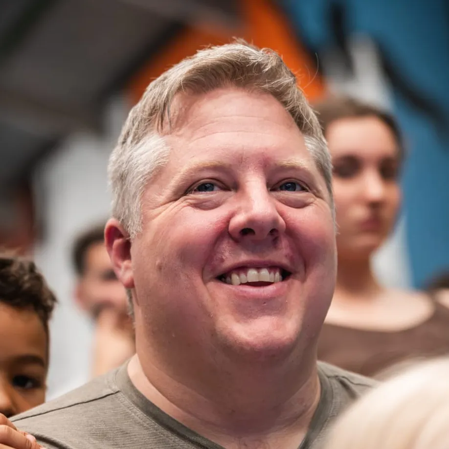 Brian, grinning in a crowd